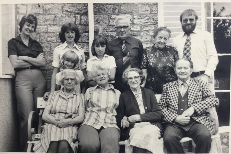 Dave Sherborne shared a family photograph taken outside Glenvue House in the seventies. In the front row, Violet and May are seated with a friend between them, while Dave and his wife stand at opposite ends of the top row.