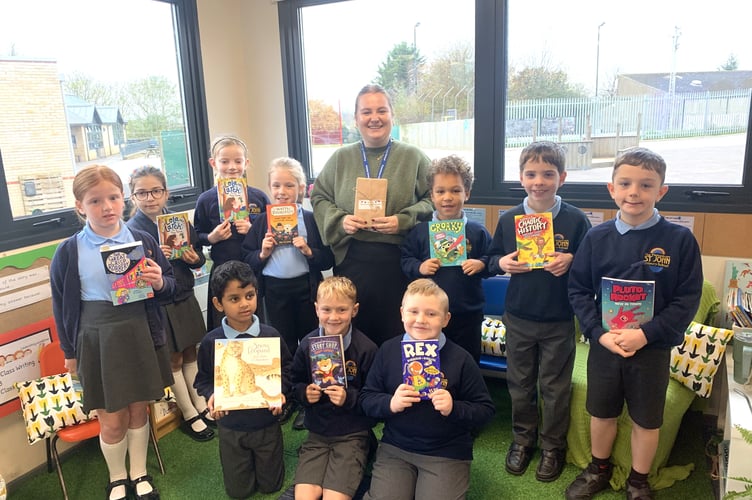Peasedown St John Primary School’s Reading Lead, Miss Lillie Skipp, with several Year 3 pupils and their new books.