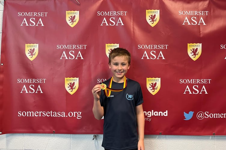 Caspere winning a gold medal at Somerset ASA Development meet at Millfield in October, 2024