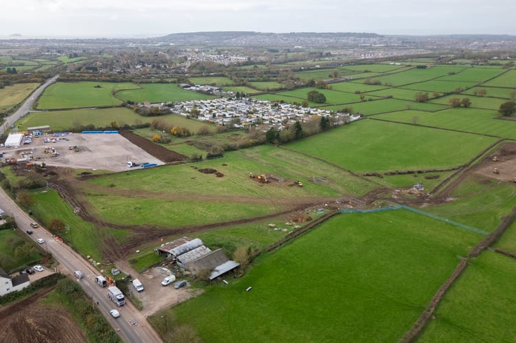 Aerial images show work being commenced to build a bypass near Banwell, Somerset. November 12 2024. Drone pictures show work is finally underway on building a bypass to save a village from gridlock - after a 100 year wait. Locals are celebrating in Banwell after areas were cleared to build the road and ease the severe congestion that has made the centre of the village a 'no go' zone for decades. The once-thriving Somerset community of 3,200 people has lost dozens of shops with health studies also showing higher rates of breathing-related health issues among its school pupils. But planning permission and funding was secured a year ago for the long-awaited bypass - with hopes it will be fully open to traffic by March 2026.