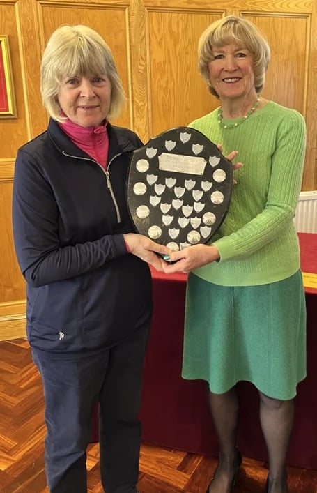 The Ladies Alliance A team captain Marion Speed, on the left, being presented with the trophy for Mendip winning Div 3 of the Bristol & District Alliance League. 