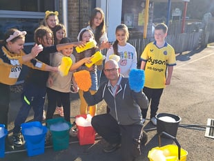 Pupils wash cars to raise money for Children in Need