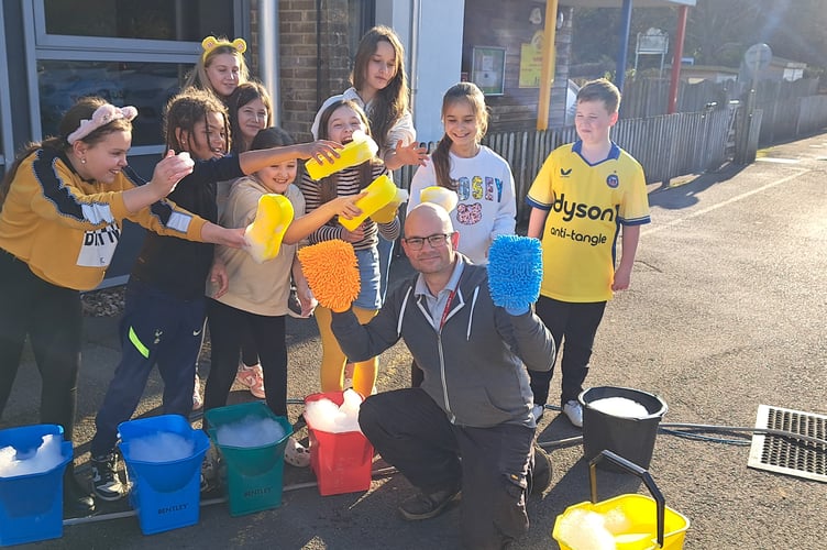 Westfield Primary School and Nursery kids washing cars to raise money