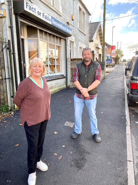 Cllr Karen Walker and Cllr Gavin Heathcote, in Bath Road, Peasedown St John, inspecting the newly refurbished pavements