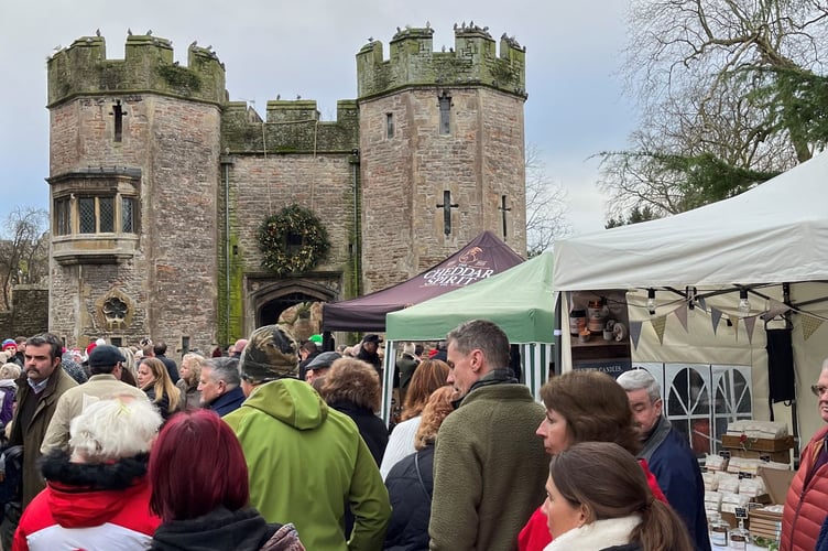 A busy Christmas market by the Bishop's Palace.