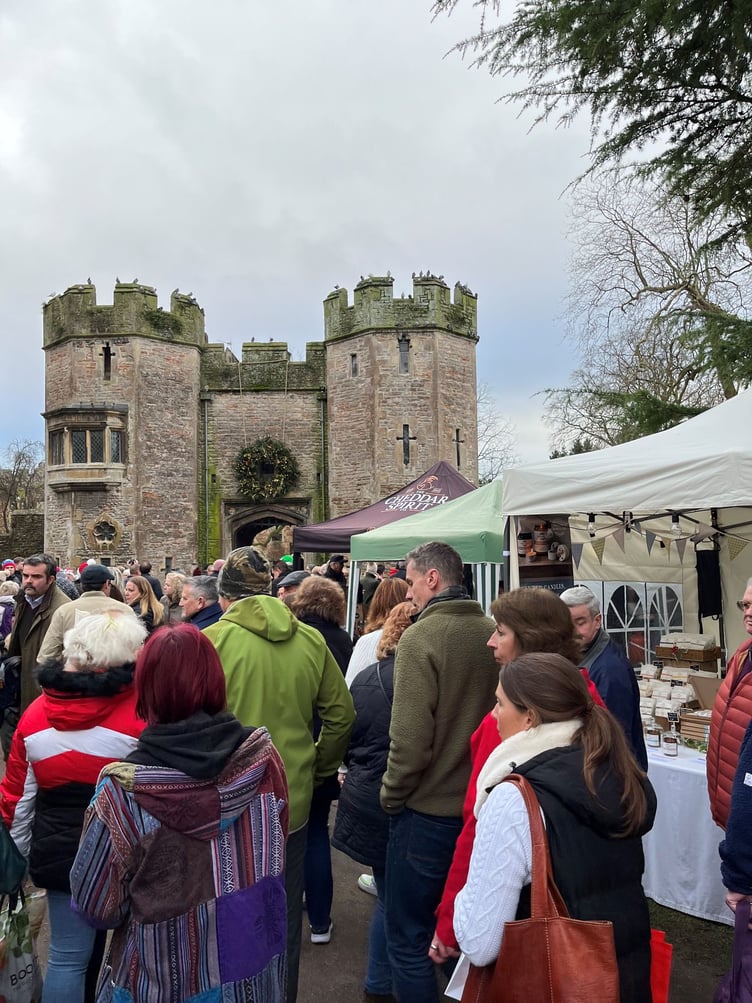 A busy Christmas market by the Bishop's Palace.