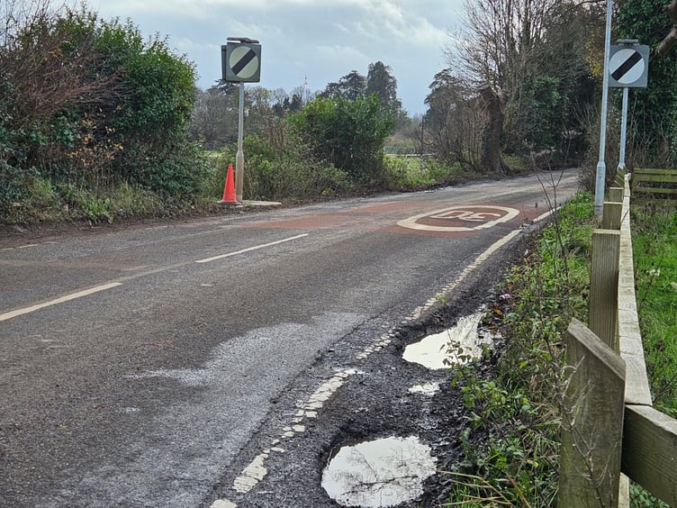 Large potholes visible along the B3355, on the narrow bend by the Rugby Club.
