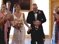 Boy, 10, beats odds and takes first steps to walk mum down aisle