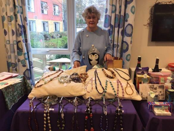 Residents and visitors enjoy the festive stalls at Rossetti House's Christmas fair, which raised £1,564 for local charity Purple Elephant.