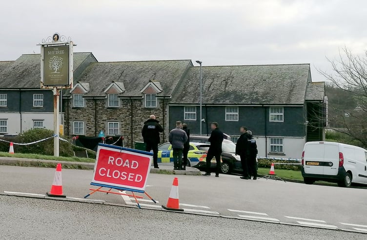 Police at the scene in Helston where the discovery of man's body in car has sparked a murder probe.  Release date  December 19, 2024.  Two women - including one in her 80s - have been arrested on suspicion of murder and concealing the body of a victim.  The suspects were detained after a murder probe was launched after the body of a man was found in a vehicle at the Helston Business Park in Cornwall.  Police were making enquiries in the Helston area in the early hours of Wednesday 18 December following concerns for welfare.  A man in his 60s, from the Somerset area, was confirmed dead at the scene. His next of kin have been informed.  Two women aged in their 50s and 80s, also from Somerset, have been arrested on suspicion of murder, concealing a death, and preventing a lawful burial. They remain in police custody at this time.