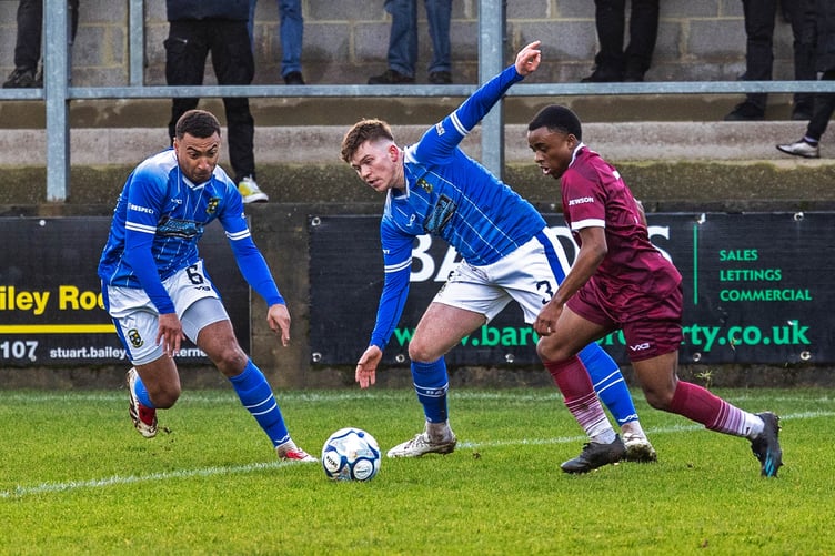 Action from Paulton's game against Buckland
