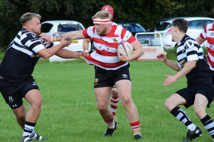 Midsomer Norton (red hoops) at Minehead earlier this season