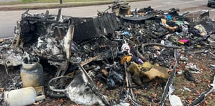 Police probe after caravan torched in 'van dweller' area