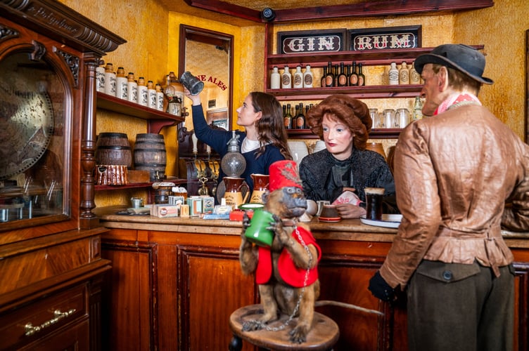 Auctioneer Carolin Lay inspects items the victorian pub The Pheasant Inn, which includes a 19th century taxidermy monkey dressed in Ottoman style clothing, before it gets sold next month from Flambards Cornwall. February 20 2025. A former theme park is auctioning nearly 1500 items - including an entire Victorian 'time capsule' village. Assets from 50 shops in the unique village and Britain and the Blitz exhibits at Flambards are going under the hammer next month after the closure after the popular Cornish attraction. After almost 50 years, rising costs and falling visitor numbers forced the attraction to shut its doors in November last year. Lay's Auctioneers have now announced a special sale of its assets which includes the historic shops that have taken visitors back in time for decades.  A spokesperon for the auctioneers said: âThe auction will encompass all 50 astonishingly detailed shops in the Victorian Village, the similarly remarkable âBritain in the Blitzâ installation, and the surrounding war galleries. âAll the supporting historical displays, including the full-size Concorde and the Avro Shackleton Cockpit."