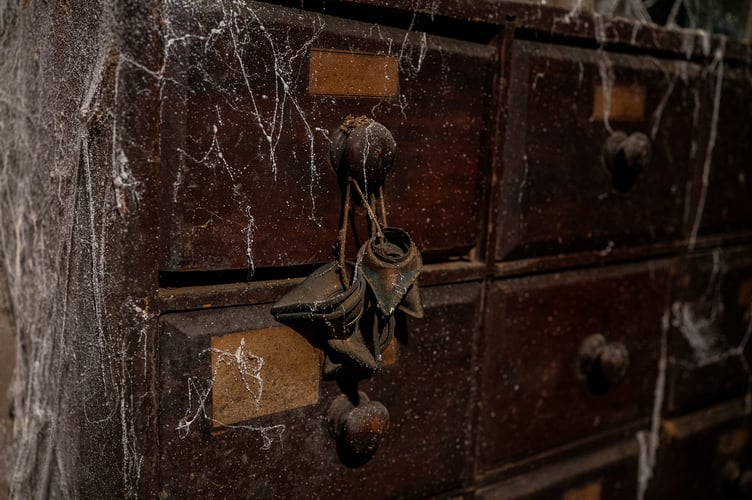 Inside the W.C.White Victorian Chemist time capsule display at Flambards, Cornwall. See SWNS story SWLNpharmacy. A Somerset pharmacy which was boarded up in the early 1900s remains almost exactly the same more than 100 years later - only now, it's in Cornwall.  The Victorian time capsule in South Petherton was discovered in the 1980s when the shop's then-owner Margaret White died. The shop had been shut since 1971, when Margaret had decided to close it rather than convert to using decimal coins. When the auctioneer went to have a look around in 1987, they discovered the back half of the shop was entirely sealed off.