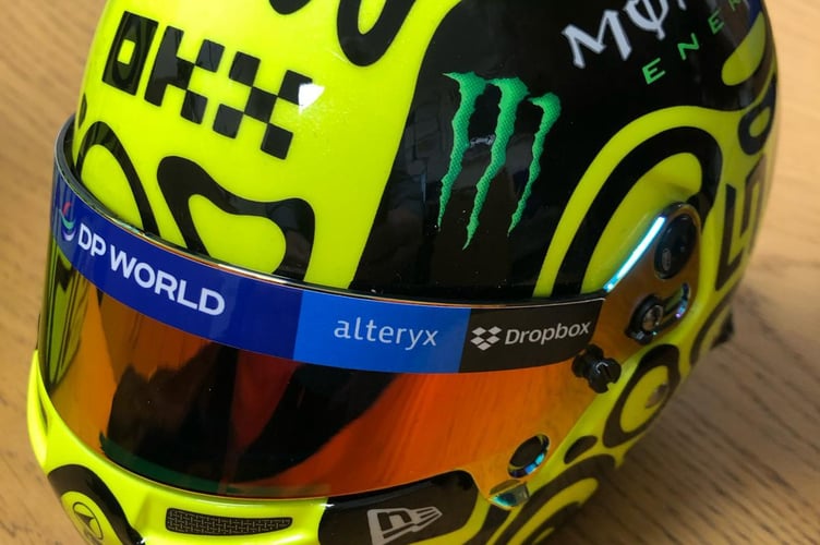 Lando Norris also gave students miniature replicas of his race helmet.