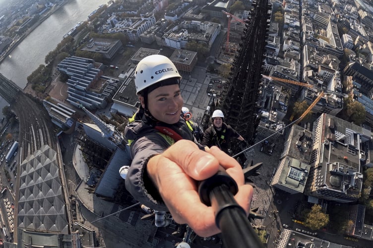 Gen Z stonemason Charlie Gee atop one of the spires at Cologne Cathedral. Photo released March 10 2025. Meet the Gen Z stonemason who has worked on historical landmarks all around Europe and is set on revolutionising interest in the trade for his young peers. Charlie Gee, 22, is a stonemason who, in the first seven years of his career, has already worked on historical landmarks like the Cologne Cathedral and the Palaces of Justice.At Cologne Cathedral, Charlie worked on the final of eight pinnacles atop one of the site's spires and oversaw the completion of all eight pinnacles for the first time since World War II.Charlie shares his work online with the direct intention of spreading awareness for stonemasonry, as he feels that a lot of people his age don't care or know about the trade anymore.
