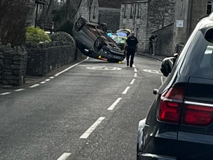 Car flipped onto its roof following crash