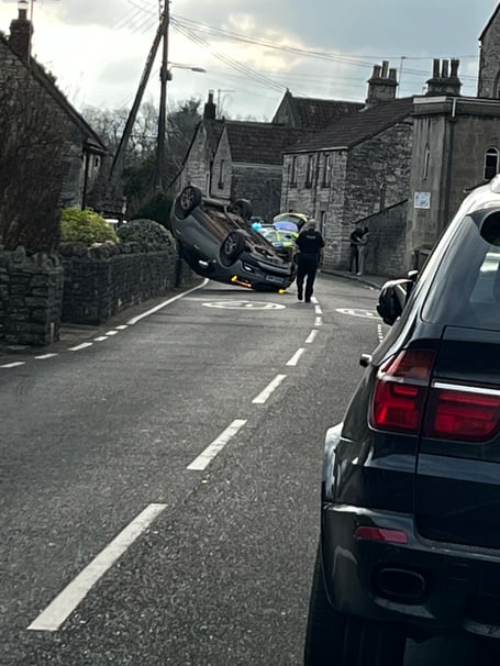North Road in Timsbury was closed after a car flipped onto its roof.