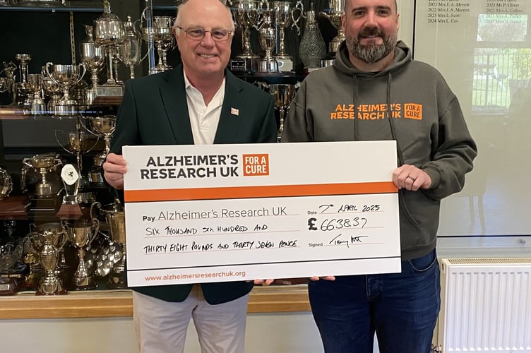 Immediate Past Seniors Captain Tony Scott presents a cheque for £6,638 to James Warren from Alzheimer’s Research UK, being monies raised during his year of captaincy