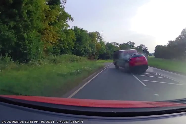 Video grab of the dashcam footage shows a minibus driving on the wrong side of the road colliding head-on with a car - leaving three people seriously injured.The Ford Transit minibus can be seen on the A30 Sherborne Road before crashing head-on with a Toyota Yaris - with a Volkswagen Polo subsequently colliding behind them both. Photo released April 17 2025.Three people were taken to hospital with serious injuries following the collision.Benjamin Charles Foster, 35 and of Yeovil in Somerset, was driving the red Ford Transit minibus. 
