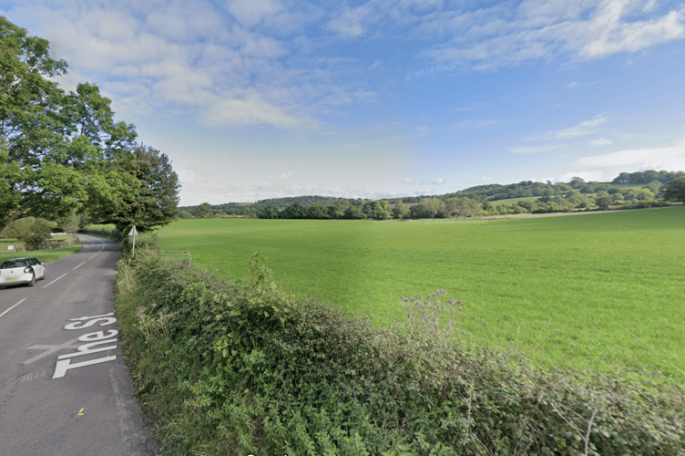 South west of The Street and Stowey Lane. 