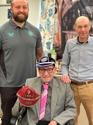 Bath Rugby and England international Tom Dunn with Stanley Francis and his son Devon Francis