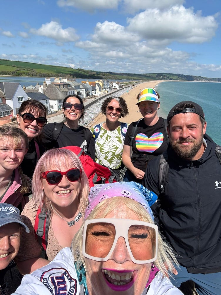 Chilcompton’s Jade Preddy (in red sunglasses) joined midlife coach Lou Featherstone and a group of hikers in Devon ahead of Lou’s UK tour, which includes a weekend of self-empowerment events in Bristol and Ebbor Gorge this May.