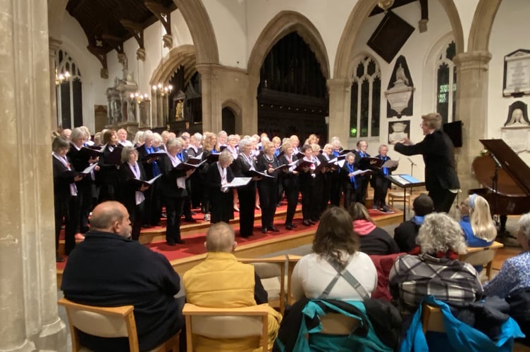The popular Keynsham community Good Afternoon Choir (left) with leader John Hare.
