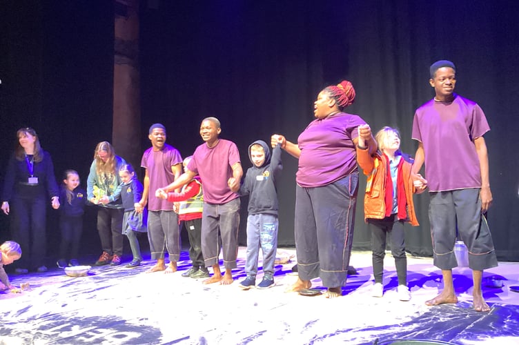 Pupils from Peasedown St John Primary School with performers on stage at The Egg Theatre at the end of the show