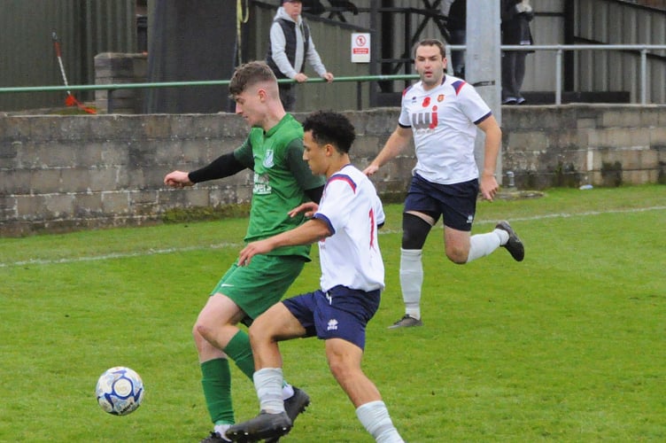 Action between Welton Rovers and Wellington last season