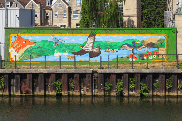 Young artists in Bath celebrate local wildlife with a vibrant mural on the River Avon, part of the Bath River Line's improvements.