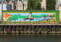 Bath artists transform river wall with wildlife mural