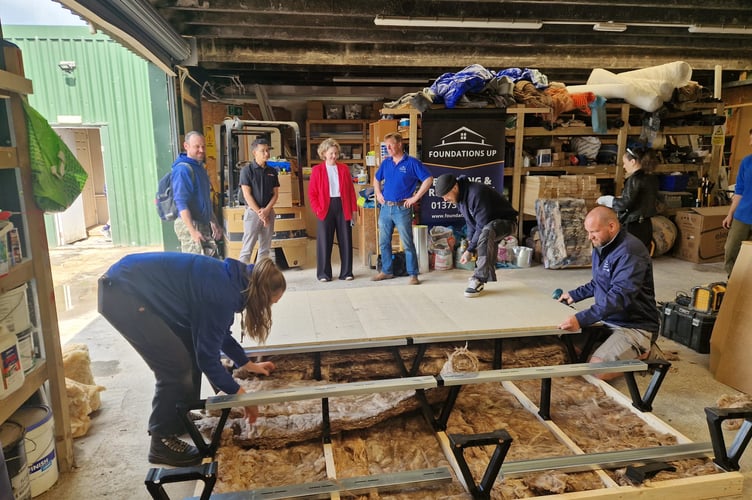 Anna Sabine, MP for Frome and East Somerset, Charles Dowson Director of Foundations Up Construction Ltd, Dave Ravel of NWHC, and other members of the team at Foundations Up Construction.