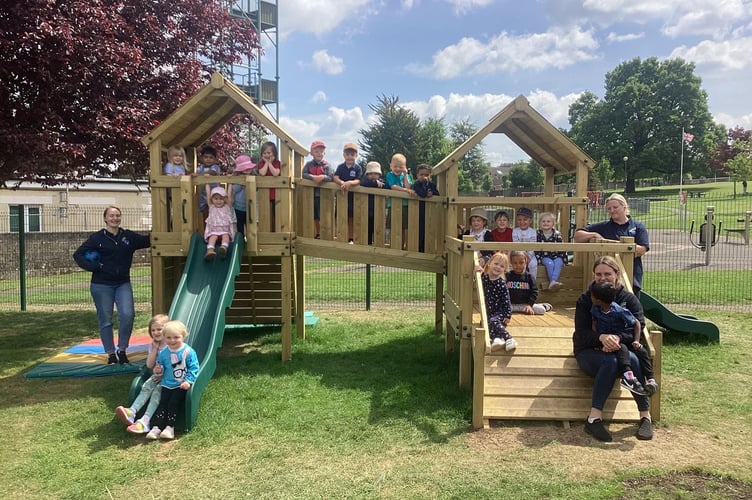 Children on the new outdoor play equipment at Noah's Ark Preschool.