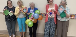 Yarnbombers celebrate a member's 95th birthday with special knit event