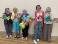 Yarnbombers celebrate a member's 95th birthday with special knit event