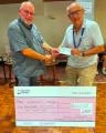 Chairman Paul Derrick (left) hands over a cheque for £600 to Dorothy House Hospice