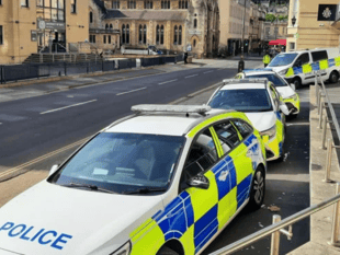 Man arrested in connection to criminal damage to four police vehicles