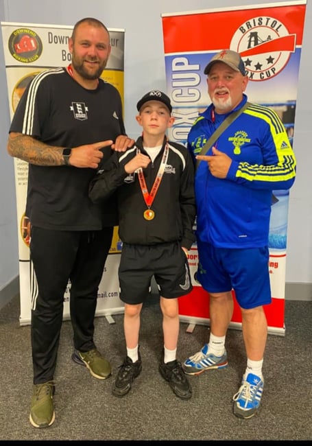 Young Shayne celebrates with his gold medal