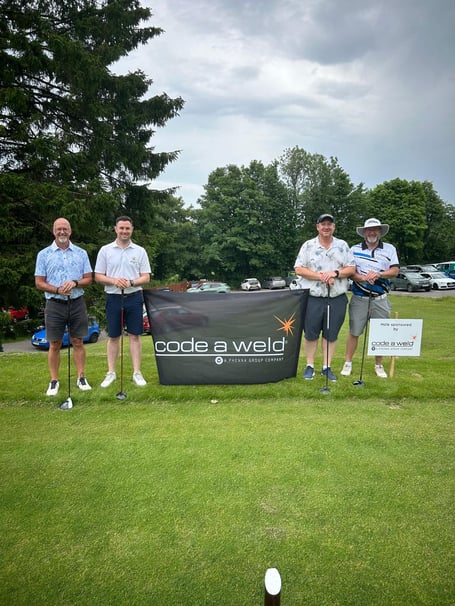 Charity Day, men’s captain Jack Hayes, second left.
