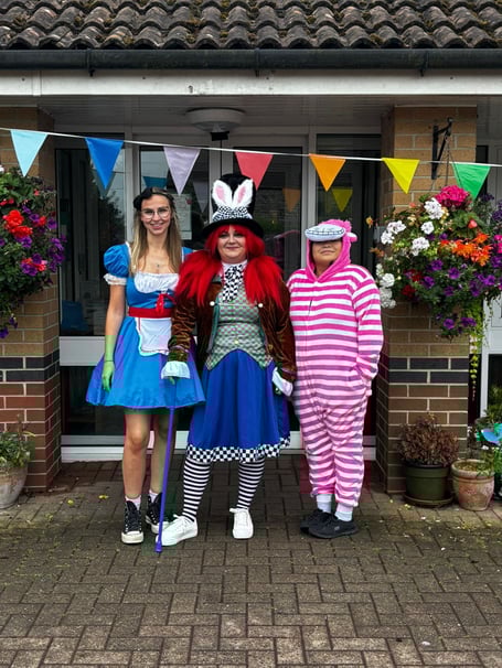 Staff dressed up as characters from Alice In Wonderland on the day of the event.