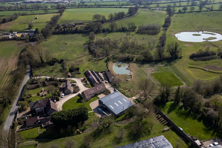 Aaron Taylor-Johnson's property in Somerset where they have excavated a large lake. Somerset. April 4 2025. Release date April 8 2025. A leading contender to be the 'next James Bond' won over his neighbours with his pond plan - after being credited with 'bringing back birds'. Aaron Taylor-Johnson and his film director wife Sam had faced public anger over plans to excavate a huge lake in the grounds of their historic Somerset home. But retrospective permission was granted papers show - and an inspection carried out last week has given the go ahead for the pond to continue operating with 'no issues' raised. And some of the couple's closest neighbours say the British actor - widely tipped to become the new 007 - has done wonders in bringing back birds to his farmland in the Mendip hills.