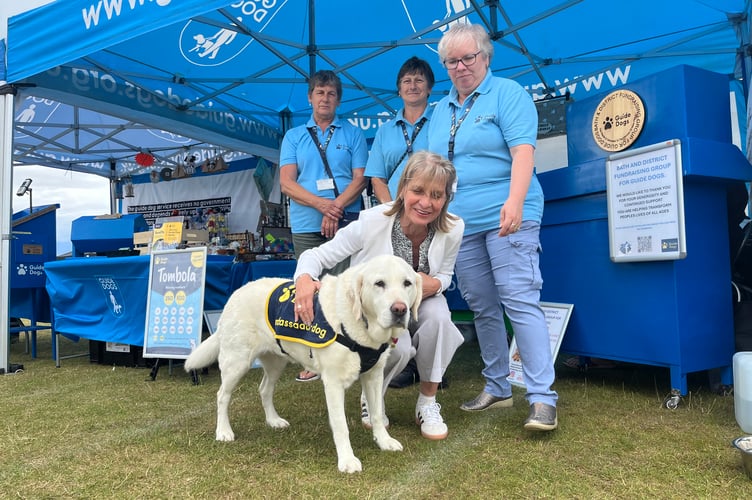 Wera Hobhouse MP with a guide dog from the organisation Guide Dogs at Odd Down community fun day.