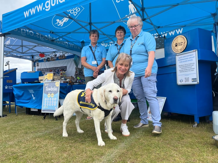Wera Hobhouse MP with a guide dog from the organisation Guide Dogs at Odd Down community fun day.