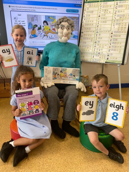Year 1 pupils with the puppet Granny Fantastic