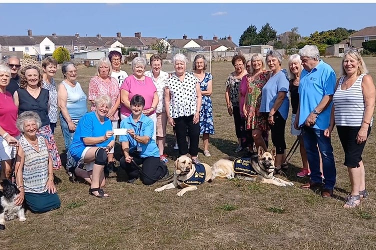 Krazy Angels line dancing group alongside members of the Guide Dog Charity.