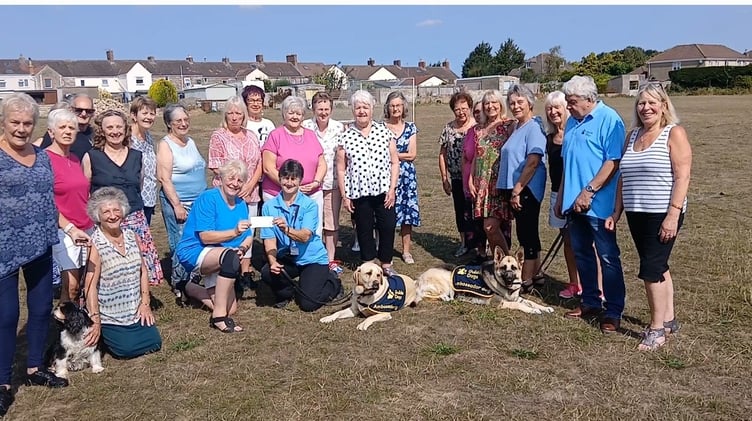 Krazy Angels line dancing group alongside members of the Guide Dog Charity.
