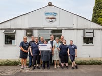 Charity receives £500 donation at event celebrating friendship