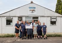 Charity receives £500 donation at event celebrating friendship